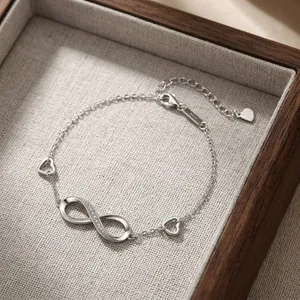 Elegant S925 sterling silver infinity symbol bracelet with hollow heart charms for women