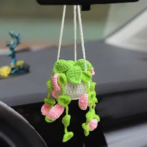 Handmade crochet hanging plant car charm with pink flowers and green leaves for rearview mirror