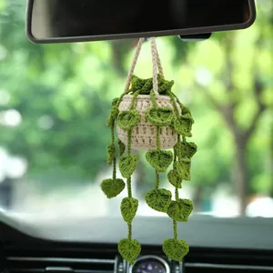 Handcrafted crochet potted plant car ornament for rearview mirror decoration.