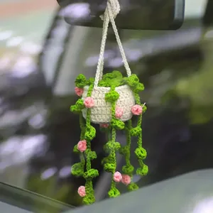 Hand-crocheted potted plant ornament for car rearview mirror hanging with pink flowers