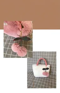 Detail of cute plush cherry handbag with faux rabbit fur texture and chain strap