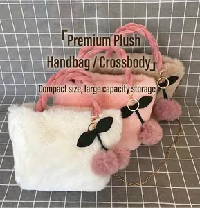 Macro view of plush faux fur cherry handbags featuring cute charms and gold chains