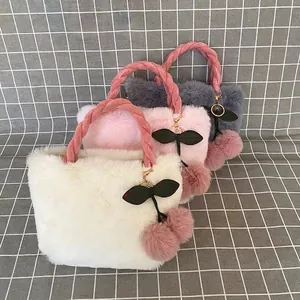 Plush faux rabbit fur tote bag featuring a cute cherry charm and twisted handles
