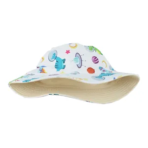 Detailed view of children's bucket hat with colorful space dinosaur cartoon print