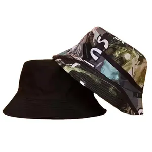 Stylish reversible bucket hat featuring a solid black side and an urban graphic print