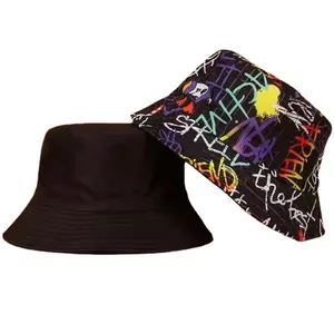 Reversible bucket hat with one solid black side and one vibrant graffiti print side
