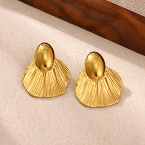 Large gold-toned chunky geometric statement earrings made of polished stainless steel