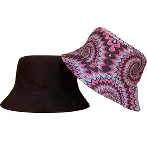 Reversible bucket hats featuring solid black and kaleidoscopic tie-dye pattern prints.