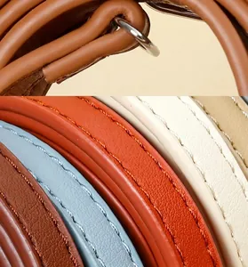 Close-up of colorful PU leather bag straps with fine stitching and durable edge sealing