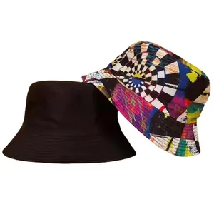 Detail view of reversible bucket hat featuring solid black and vibrant tie-dye print