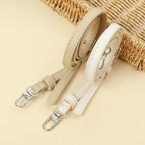 Two adjustable PU leather replacement shoulder straps for crossbody bags in cream and khaki.