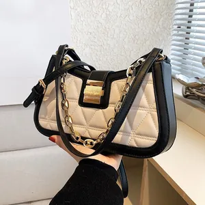 Fashionable black and white quilted crossbody bag with stylish gold chain strap for women