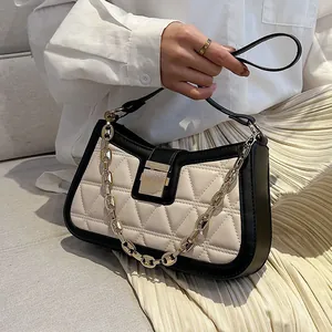 Stylish quilted women's shoulder bag with gold chain and black trim accents