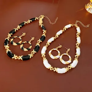 Vintage luxury palace style jewelry set including necklace and earrings in black and white