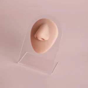 Realistic silicone nose model for piercing practice and jewelry display on acrylic stand
