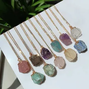 Collection of wire-wrapped raw natural crystal stone necklaces in various colors