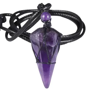 Detail macro view of natural amethyst hexagonal pendant with black cord wrapping