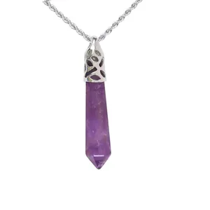 Detailed view of a hexagonal amethyst crystal pendant with a silver ornate cap on rope chain