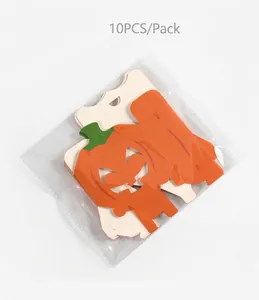 Detailed view of flat-packed Halloween pumpkin candy boxes, 10 pieces per retail pack