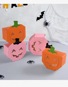 Set of Halloween pumpkin candy boxes with hollow smiling face design for party favors