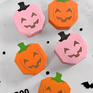 Set of Halloween pumpkin candy boxes with hollow-out funny face designs for parties