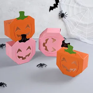 Decorative Halloween pumpkin candy boxes with hollow funny faces for party treat gifts