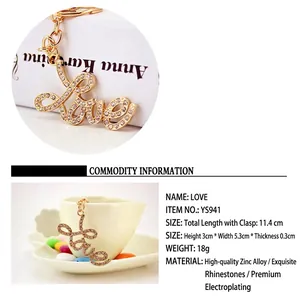 Detail view of golden rhinestone Love keychain with dimensions and material specs.
