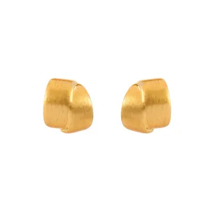 Professional macro shot of matte brushed gold twisted earrings with a minimalist design