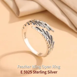 Close-up of S925 sterling silver open ring with feather wing design