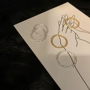 Detailed view of S925 sterling silver shimmering chain rings in both gold and silver tones