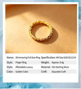 Detailed view of the 925 sterling silver sparkling gold textured stackable ring specs.