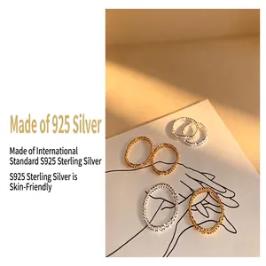 Close-up detail of sparkling S925 sterling silver chain rings for stackable jewelry wear