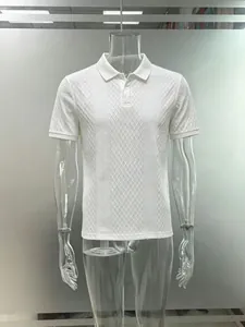 Detailed view of a men's white jacquard polo shirt with textured diamond patterns.
