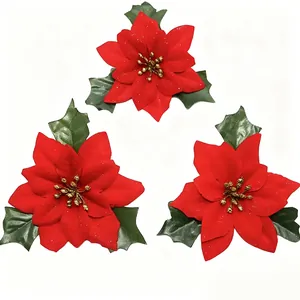 Set of three 12cm artificial red flocked poinsettia flowers with green leaves for decor