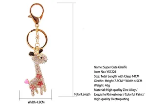 Detail of a sparkling giraffe keychain with rhinestone-encrusted body and dimensions.