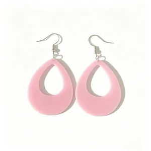 Close-up view of elegant pink waterdrop-shaped acrylic earrings with smooth matte finish.