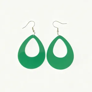 Close-up view of vibrant green teardrop acrylic earrings featuring a smooth glossy finish.