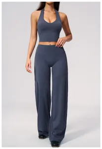 Women's high-waisted brushed wide-leg yoga pants in a soft dark grey athletic fabric.