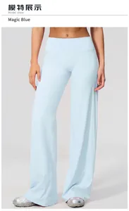 Detail of light blue wide-leg yoga pants with high waist and soft brushed fabric
