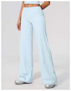 Close-up of light blue wide-leg yoga pants showing soft brushed fabric and fit