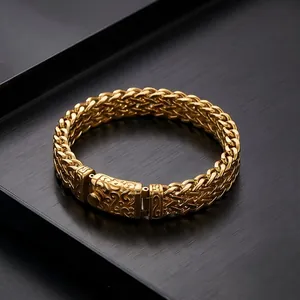 Close-up of a premium gold-toned titanium steel dragon bone chain bracelet for men.