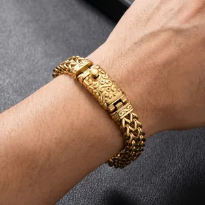 Macro detail shot of a gold punk-style titanium steel dragon bone chain bracelet on a male wrist