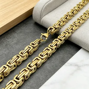 Close-up of gold stainless steel Byzantine chain necklace with secure lobster clasp