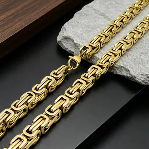 Detailed macro view of heavy golden Byzantine chain link craftsmanship in titanium steel