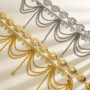 Detailed view of bohemian gold and silver waist chains with sun medallions and tassels