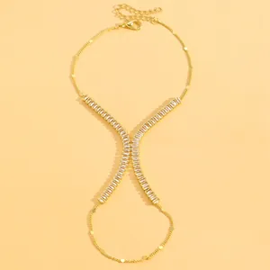 Elegant gold-plated slave bracelet featuring sparkling rectangular crystal accents.