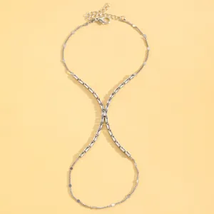 Detailed view of silver minimalist finger bracelet with sparkling rectangular crystals