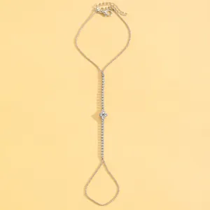 Detail view of a silver-toned slave bracelet adorned with shimmering crystal accents