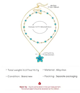 Detail view of blue enamel flower necklace with crystal chain and technical dimensions.