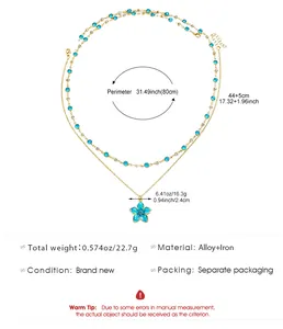 Detailed view of a sweet blue oil-drop flower pendant necklace with gold alloy chain.